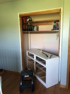 white dresser in closet