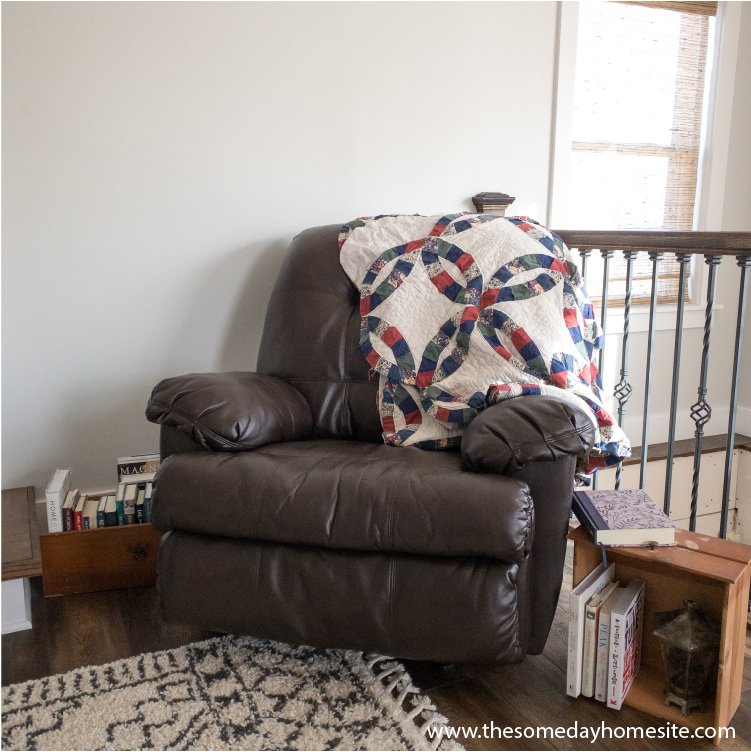 brown recliner flanked by two old drawers holding books