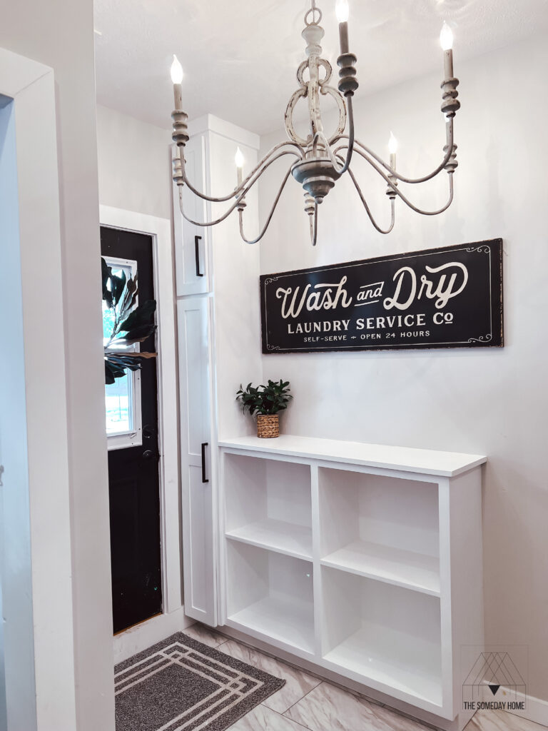 Built in cabinets for a laundry room. White shaker style cabinetry.