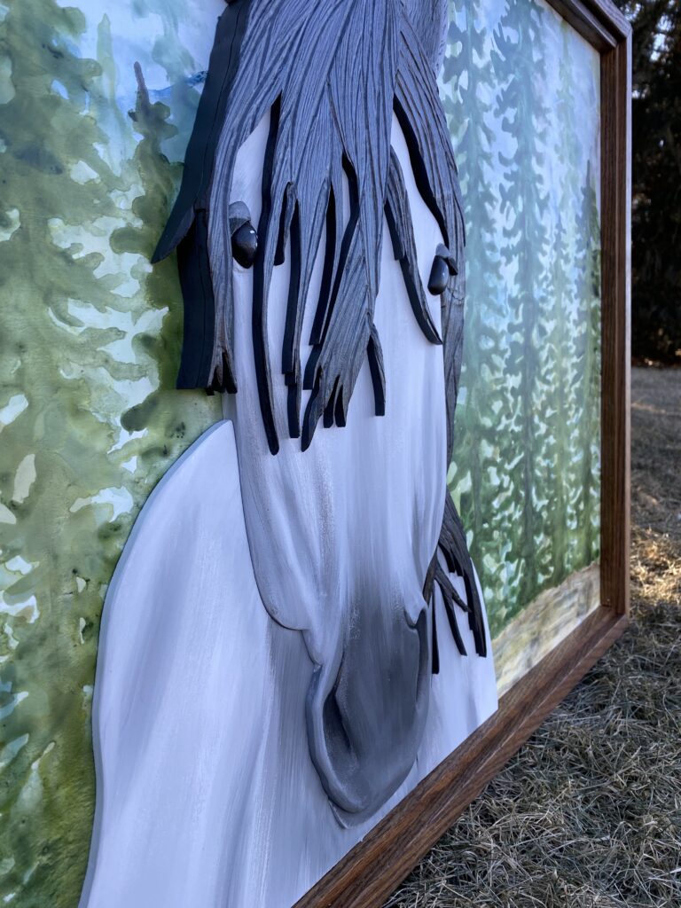 Large sign with carved white and grey horse in the foreground, watercolor pine trees in the background.